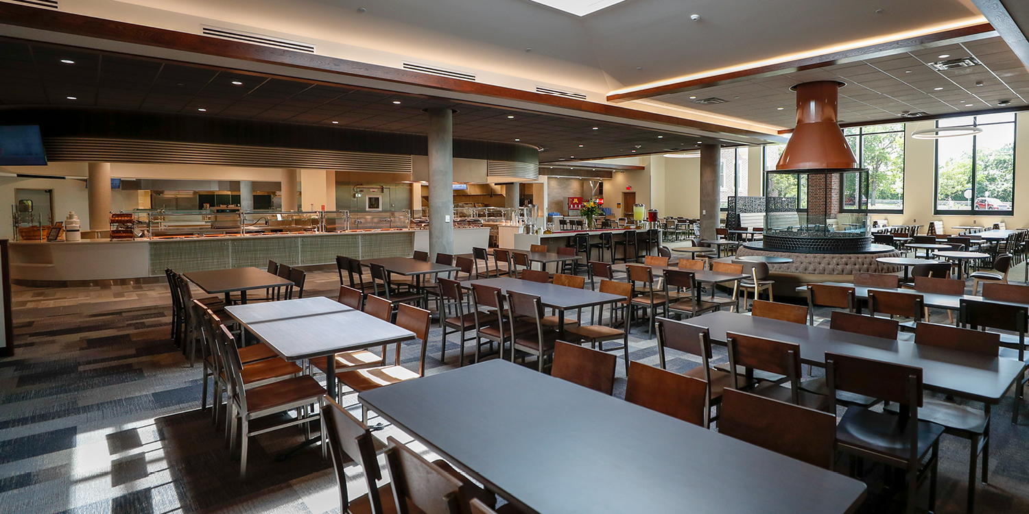Pioneer Dining Hall, Tables in Foreground with a Buffet in the Background